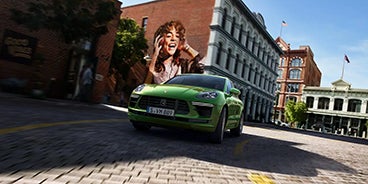Blue Porsche Macan Turning a Corner in St. Louis MO