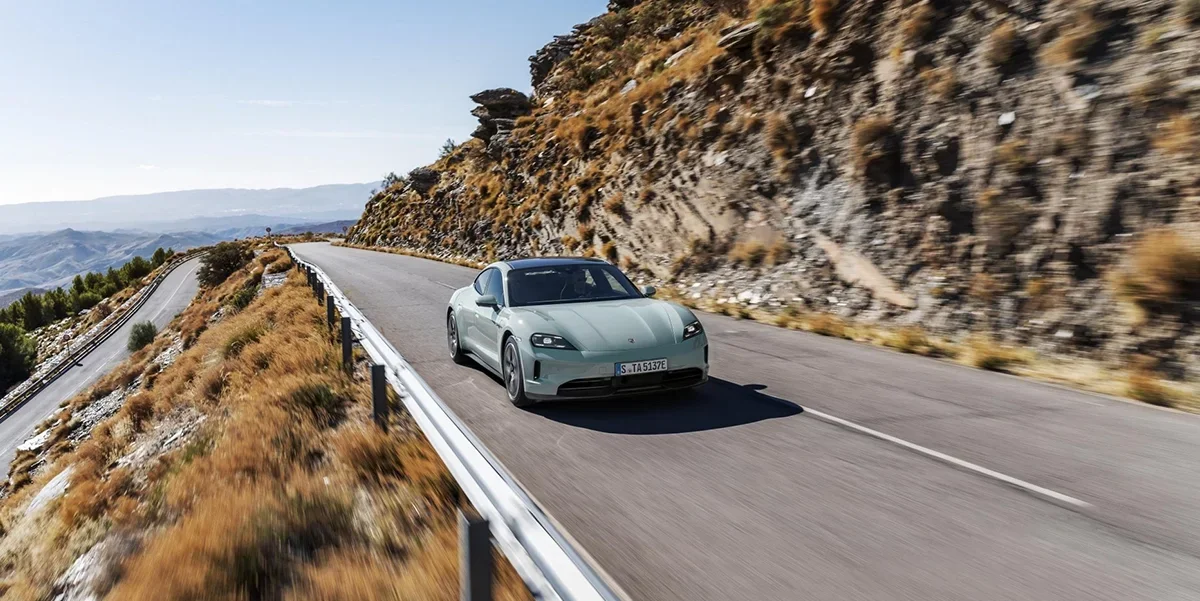 Porsche St. Louis 2025 Taycan driving Wildwood